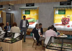 The Green Egypt stand. On the left table facing us is company president Sherif Attia during one of his meetings. The Egyptian exporter trades a variety of fruits and vegetables, like grapes, strawberries, asparagus and beans.